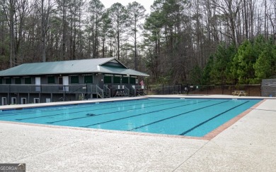 Nestled atop a gentle hill and surrounded by graceful Hemlocks on White Path Golf Club in Georgia - for sale on GolfHomes.com, golf home, golf lot