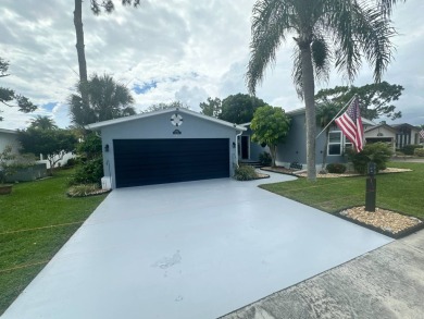 This completely remodeled, stucco Palm Harbor home is located on on Del Tura Golf and Country Club in Florida - for sale on GolfHomes.com, golf home, golf lot