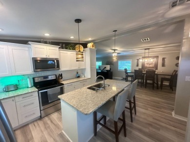 This completely remodeled, stucco Palm Harbor home is located on on Del Tura Golf and Country Club in Florida - for sale on GolfHomes.com, golf home, golf lot