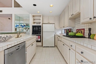 Perched on a quiet street in Vista's desirable Shadowridge area on Shadowridge Country Club in California - for sale on GolfHomes.com, golf home, golf lot