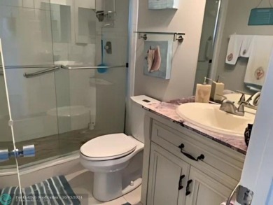 Stunningly renovated 8th floor *F* unit in coveted Building 114 on Palm-Aire Country Club and Resort - Palms in Florida - for sale on GolfHomes.com, golf home, golf lot