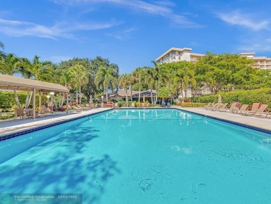 Stunningly renovated 8th floor *F* unit in coveted Building 114 on Palm-Aire Country Club and Resort - Palms in Florida - for sale on GolfHomes.com, golf home, golf lot