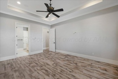Exquisite home on the beautiful Tascosa Golf Course between on Tascosa Country Club in Texas - for sale on GolfHomes.com, golf home, golf lot