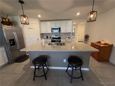 This almost new (built in 2022), beautifully designed 4-bedroom on Twisted Oaks Golf Club in Florida - for sale on GolfHomes.com, golf home, golf lot