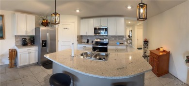 This almost new (built in 2022), beautifully designed 4-bedroom on Twisted Oaks Golf Club in Florida - for sale on GolfHomes.com, golf home, golf lot