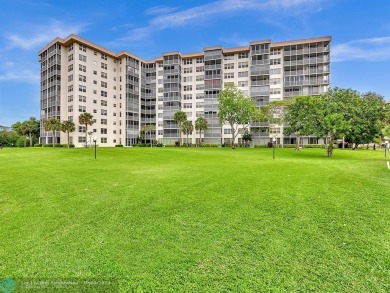 Stunningly renovated 8th floor *F* unit in coveted Building 114 on Palm-Aire Country Club and Resort - Palms in Florida - for sale on GolfHomes.com, golf home, golf lot