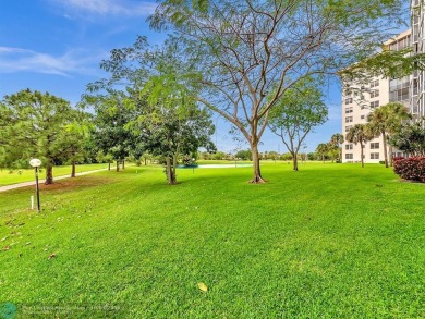 Stunningly renovated 8th floor *F* unit in coveted Building 114 on Palm-Aire Country Club and Resort - Palms in Florida - for sale on GolfHomes.com, golf home, golf lot