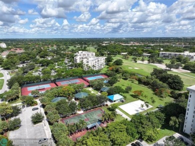 Stunningly renovated 8th floor *F* unit in coveted Building 114 on Palm-Aire Country Club and Resort - Palms in Florida - for sale on GolfHomes.com, golf home, golf lot