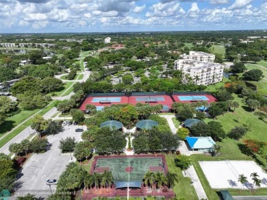 Stunningly renovated 8th floor *F* unit in coveted Building 114 on Palm-Aire Country Club and Resort - Palms in Florida - for sale on GolfHomes.com, golf home, golf lot