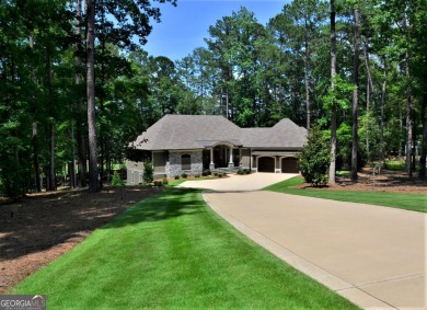 With beautiful lake views, this home is located in the sought on Reynolds Lake Oconee - The Oconee in Georgia - for sale on GolfHomes.com, golf home, golf lot