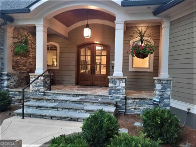With beautiful lake views, this home is located in the sought on Reynolds Lake Oconee - The Oconee in Georgia - for sale on GolfHomes.com, golf home, golf lot