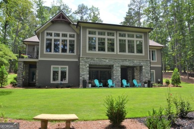 With beautiful lake views, this home is located in the sought on Reynolds Lake Oconee - The Oconee in Georgia - for sale on GolfHomes.com, golf home, golf lot