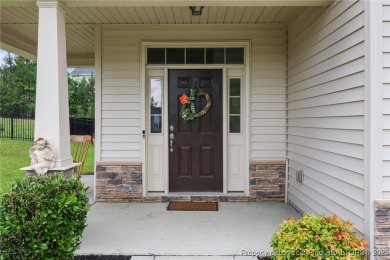 Stunning and spacious four-bedroom home with a versatile bonus on Anderson Creek Golf Club in North Carolina - for sale on GolfHomes.com, golf home, golf lot