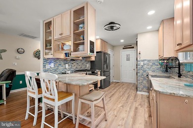 Welcome to this stunning single-level waterfront rancher in on Ocean Pines Golf and Country Club in Maryland - for sale on GolfHomes.com, golf home, golf lot