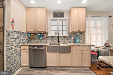 Welcome to this stunning single-level waterfront rancher in on Ocean Pines Golf and Country Club in Maryland - for sale on GolfHomes.com, golf home, golf lot