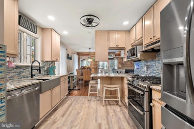 Welcome to this stunning single-level waterfront rancher in on Ocean Pines Golf and Country Club in Maryland - for sale on GolfHomes.com, golf home, golf lot