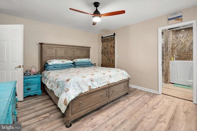 Welcome to this stunning single-level waterfront rancher in on Ocean Pines Golf and Country Club in Maryland - for sale on GolfHomes.com, golf home, golf lot