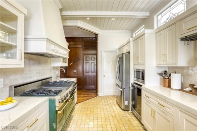 Inside exclusive gates of Canyon Gate, this elegant golf villa on Canyon Gate Country Club in Nevada - for sale on GolfHomes.com, golf home, golf lot