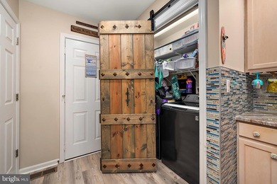 Welcome to this stunning single-level waterfront rancher in on Ocean Pines Golf and Country Club in Maryland - for sale on GolfHomes.com, golf home, golf lot