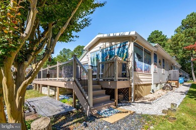 Welcome to this stunning single-level waterfront rancher in on Ocean Pines Golf and Country Club in Maryland - for sale on GolfHomes.com, golf home, golf lot