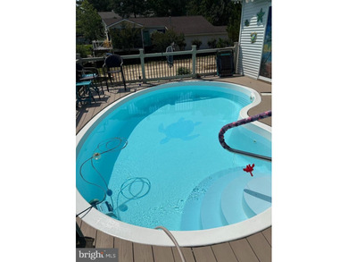 Welcome to this stunning single-level waterfront rancher in on Ocean Pines Golf and Country Club in Maryland - for sale on GolfHomes.com, golf home, golf lot