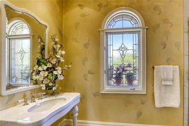 Inside exclusive gates of Canyon Gate, this elegant golf villa on Canyon Gate Country Club in Nevada - for sale on GolfHomes.com, golf home, golf lot