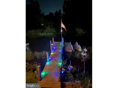 Welcome to this stunning single-level waterfront rancher in on Ocean Pines Golf and Country Club in Maryland - for sale on GolfHomes.com, golf home, golf lot