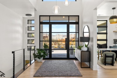 Entering through the striking metal-glass front door into a on The Ledges Golf Club in Utah - for sale on GolfHomes.com, golf home, golf lot