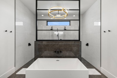 Entering through the striking metal-glass front door into a on The Ledges Golf Club in Utah - for sale on GolfHomes.com, golf home, golf lot