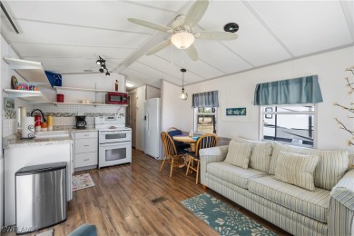 Welcome to this cozy and efficient 1-bedroom manufactured home on Del Tura Golf and Country Club in Florida - for sale on GolfHomes.com, golf home, golf lot