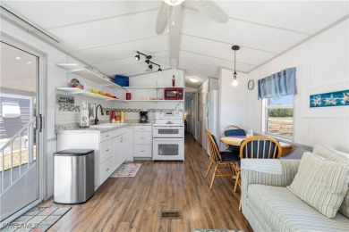 Welcome to this cozy and efficient 1-bedroom manufactured home on Del Tura Golf and Country Club in Florida - for sale on GolfHomes.com, golf home, golf lot