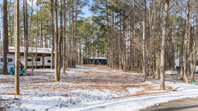 JUST BRING YOUR CAMPER!! Beautifully Level Double Lot Available on River Golf and Country Club at Lake Royale in North Carolina - for sale on GolfHomes.com, golf home, golf lot