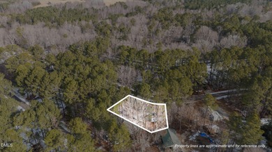 JUST BRING YOUR CAMPER!! Beautifully Level Double Lot Available on River Golf and Country Club at Lake Royale in North Carolina - for sale on GolfHomes.com, golf home, golf lot