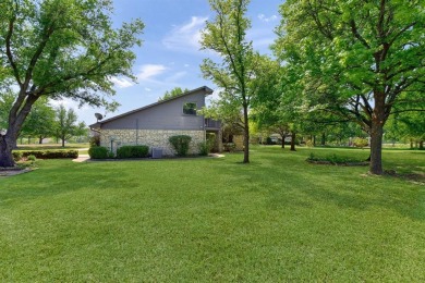 Discover serenity in this custom Stone home situated on over 1.2 on Denison Country Club in Texas - for sale on GolfHomes.com, golf home, golf lot
