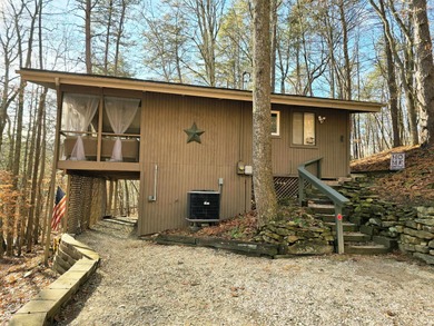 Escape to your serene retreat in the woods. Nestled above Lake on Hide-A-Way Hills Golf Club in Ohio - for sale on GolfHomes.com, golf home, golf lot