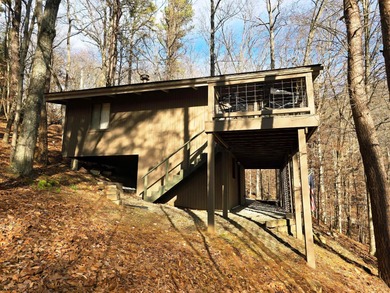 Escape to your serene retreat in the woods. Nestled above Lake on Hide-A-Way Hills Golf Club in Ohio - for sale on GolfHomes.com, golf home, golf lot