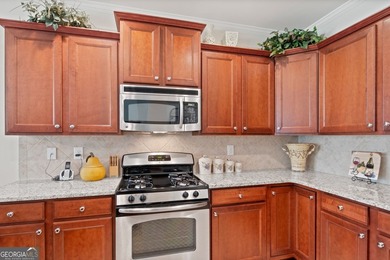 Located on prime golf lot hole #13 in the vibrant Active Adult on Canongate Golf At Sun City Peachtree in Georgia - for sale on GolfHomes.com, golf home, golf lot