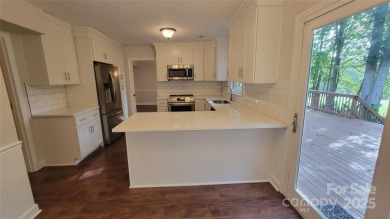 Experience luxury living in one of South Charlotte's most on Raintree Country Club in North Carolina - for sale on GolfHomes.com, golf home, golf lot