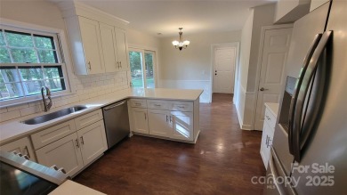 Experience luxury living in one of South Charlotte's most on Raintree Country Club in North Carolina - for sale on GolfHomes.com, golf home, golf lot