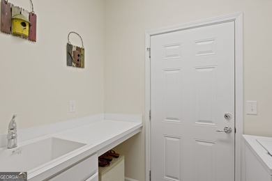 Located on prime golf lot hole #13 in the vibrant Active Adult on Canongate Golf At Sun City Peachtree in Georgia - for sale on GolfHomes.com, golf home, golf lot