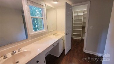 Experience luxury living in one of South Charlotte's most on Raintree Country Club in North Carolina - for sale on GolfHomes.com, golf home, golf lot