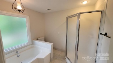Experience luxury living in one of South Charlotte's most on Raintree Country Club in North Carolina - for sale on GolfHomes.com, golf home, golf lot