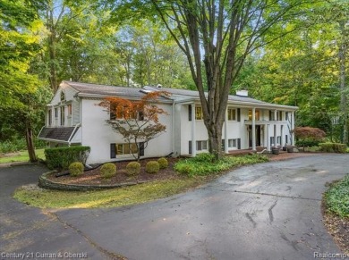 Tucked away on a wooded lot that directly backs up to McClumpha on Hilltop Golf Course in Michigan - for sale on GolfHomes.com, golf home, golf lot