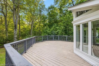 Tucked away on a wooded lot that directly backs up to McClumpha on Hilltop Golf Course in Michigan - for sale on GolfHomes.com, golf home, golf lot
