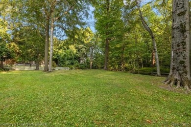 Tucked away on a wooded lot that directly backs up to McClumpha on Hilltop Golf Course in Michigan - for sale on GolfHomes.com, golf home, golf lot