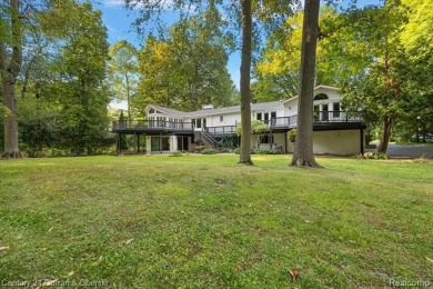 Tucked away on a wooded lot that directly backs up to McClumpha on Hilltop Golf Course in Michigan - for sale on GolfHomes.com, golf home, golf lot