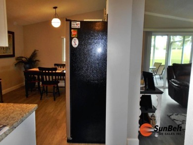 Totally renovated home on the golf course with golf cart on Rolling Greens Executive Golf Community in Florida - for sale on GolfHomes.com, golf home, golf lot
