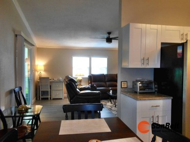 Totally renovated home on the golf course with golf cart on Rolling Greens Executive Golf Community in Florida - for sale on GolfHomes.com, golf home, golf lot