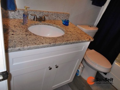 Totally renovated home on the golf course with golf cart on Rolling Greens Executive Golf Community in Florida - for sale on GolfHomes.com, golf home, golf lot