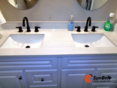 Totally renovated home on the golf course with golf cart on Rolling Greens Executive Golf Community in Florida - for sale on GolfHomes.com, golf home, golf lot
